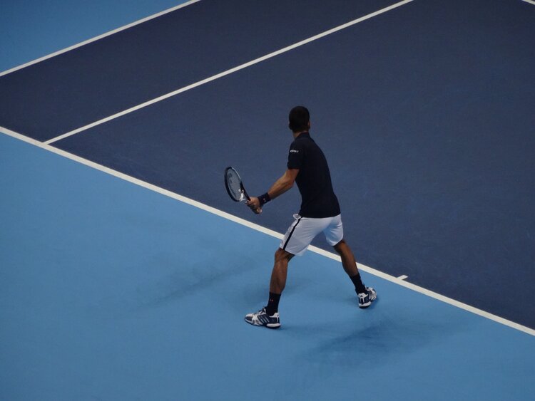 Gus Hansen playing tennis Gus Hansen playing tennis